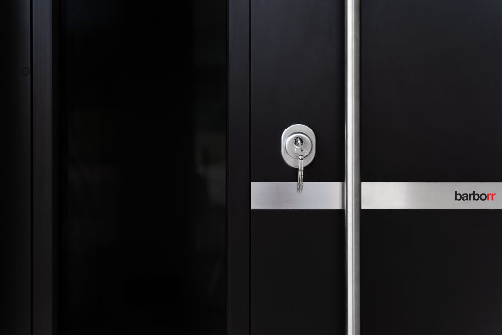 Specialist installing a steel security door