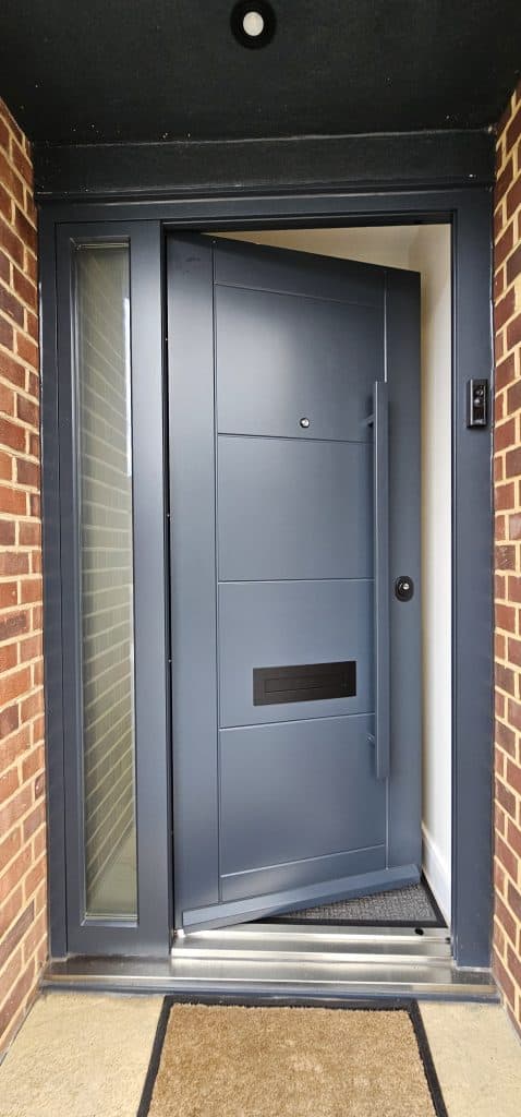 Modern grey security door with long handle