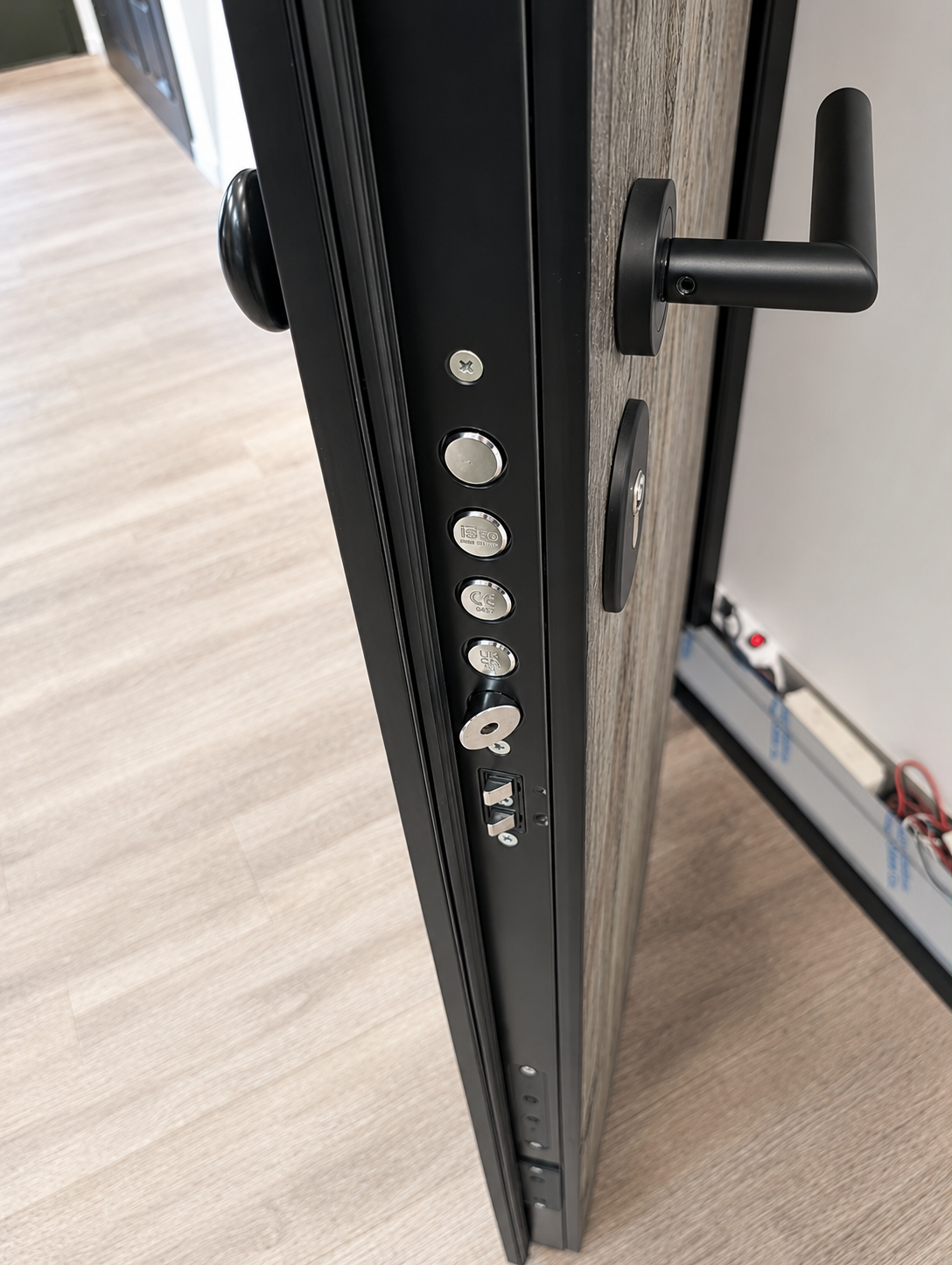 X1R Smart lock installed on armoured door — side profile with multi-point locking