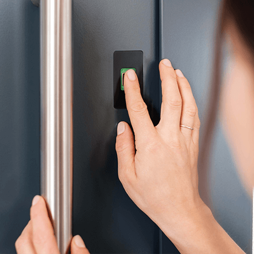 Finger touching the ekey dLine scanner with green LED ring